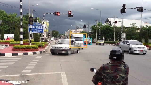 Anonymised keyframe of truck then car